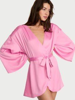 Woman wearing a pink plush robe